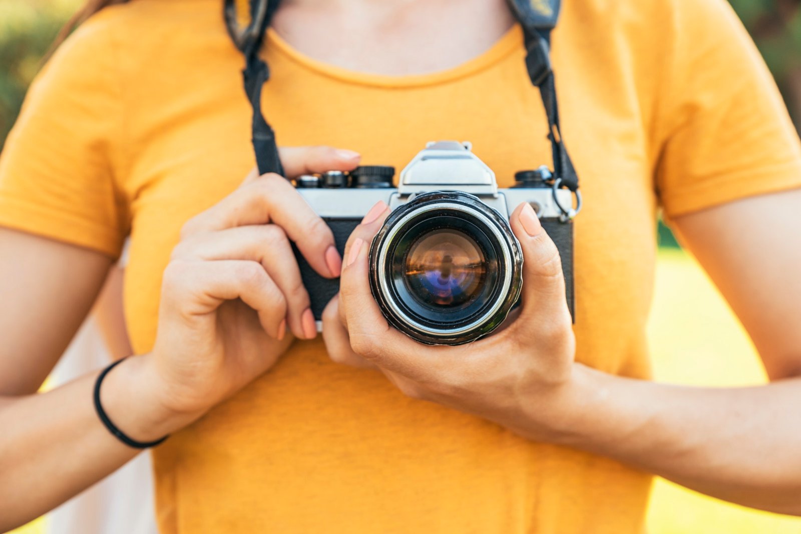 Close up of a photographer with her camera.